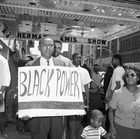 Floyd McKissick Holding Black Power Sign